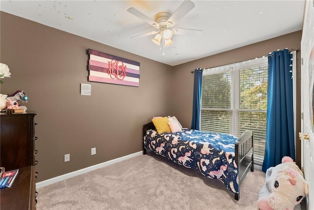 bedroom with ceiling fan and carpet