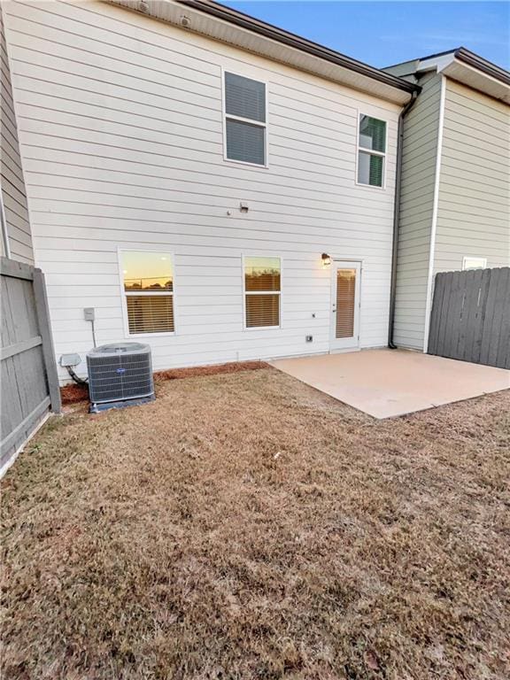 back of property featuring central AC unit and a patio area