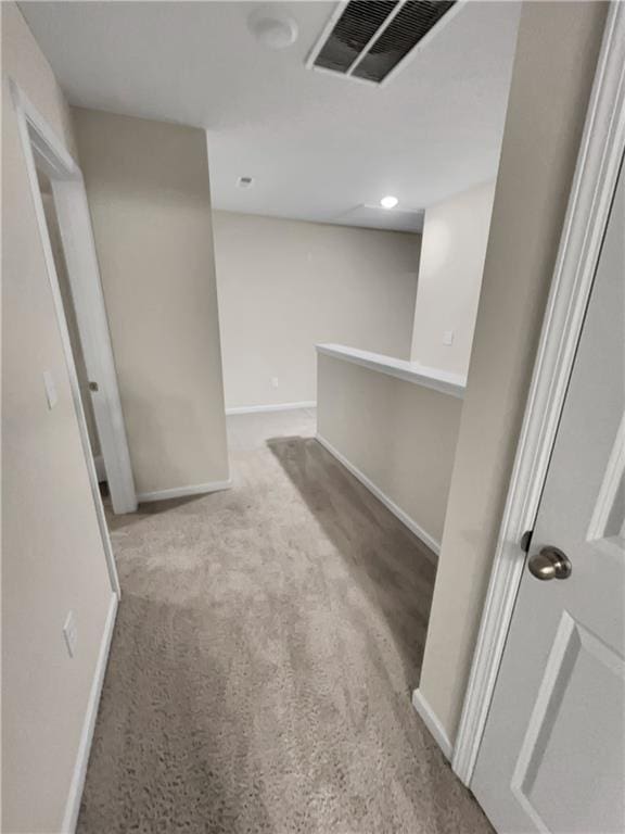 unfurnished room with light colored carpet