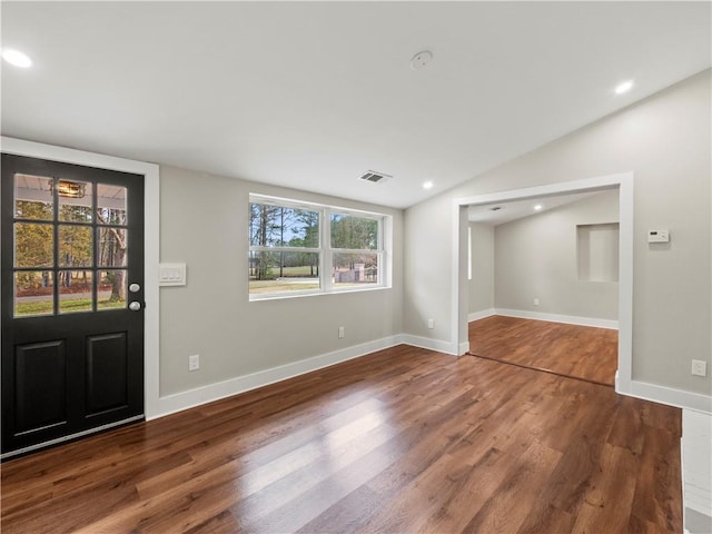 entryway with lofted ceiling, dark wood-style flooring, baseboards, and recessed lighting