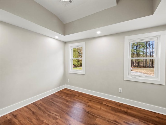 spare room featuring baseboards, visible vents, wood finished floors, and recessed lighting