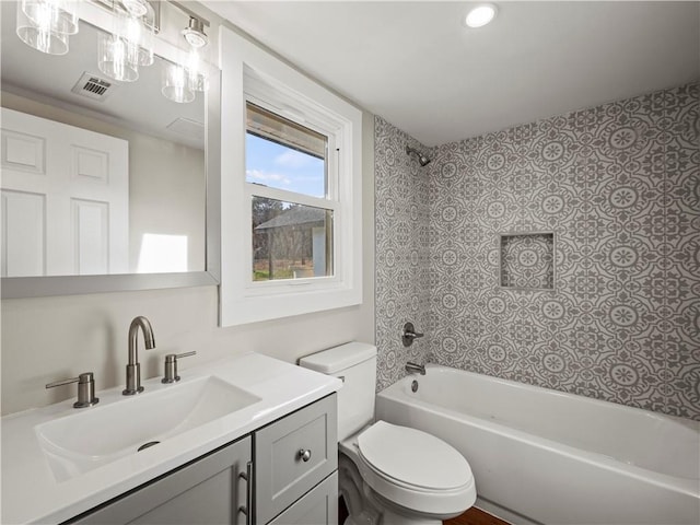 full bath with shower / washtub combination, visible vents, vanity, and toilet