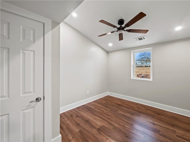 empty room featuring dark wood-type flooring, recessed lighting, visible vents, and baseboards