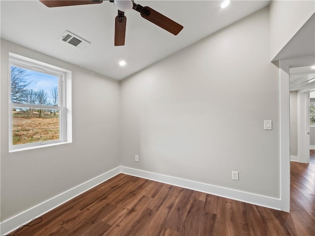 spare room with baseboards, visible vents, wood finished floors, and recessed lighting