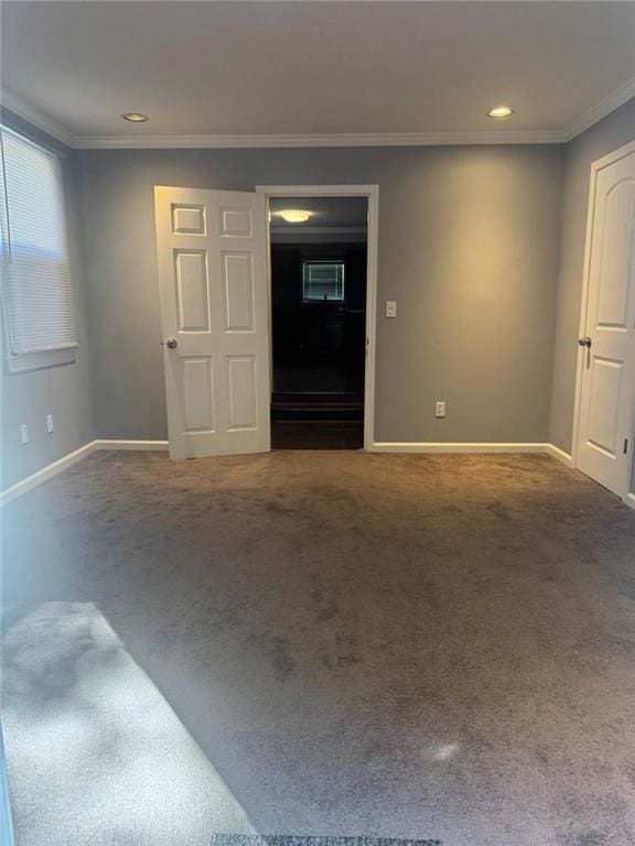 unfurnished living room featuring baseboards, crown molding, carpet floors, and recessed lighting
