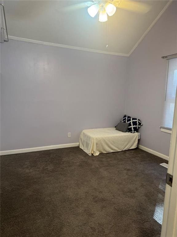 bedroom with vaulted ceiling, crown molding, baseboards, ceiling fan, and dark carpet