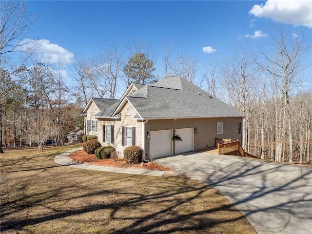 view of home's exterior featuring a garage and a lawn