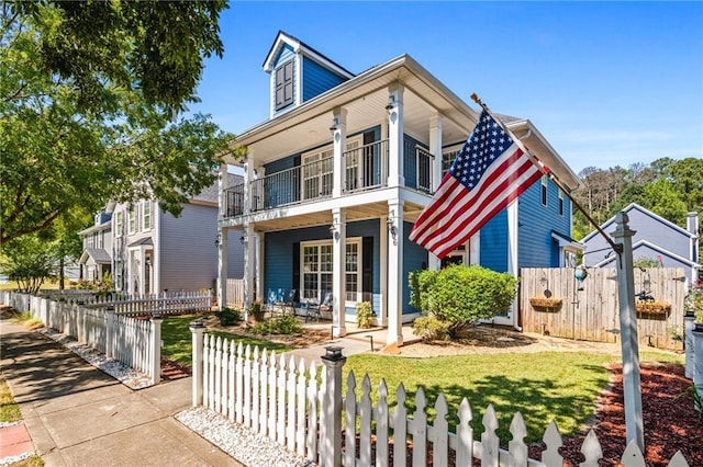 view of front of property with a balcony