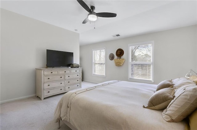 bedroom featuring light carpet, visible vents, ceiling fan, and baseboards