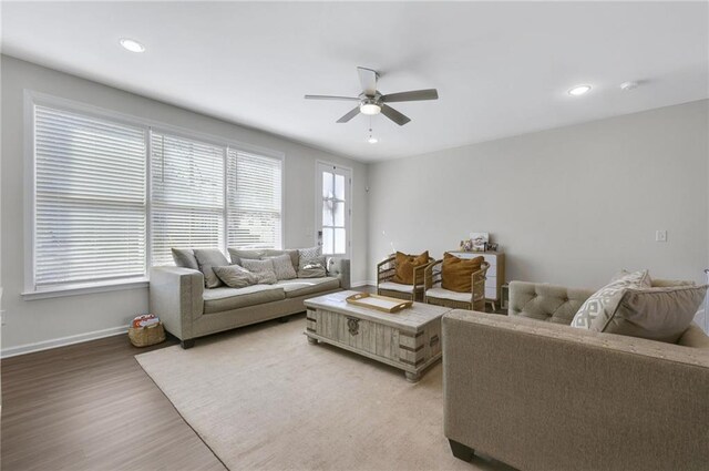 living room with recessed lighting, baseboards, ceiling fan, and light wood finished floors