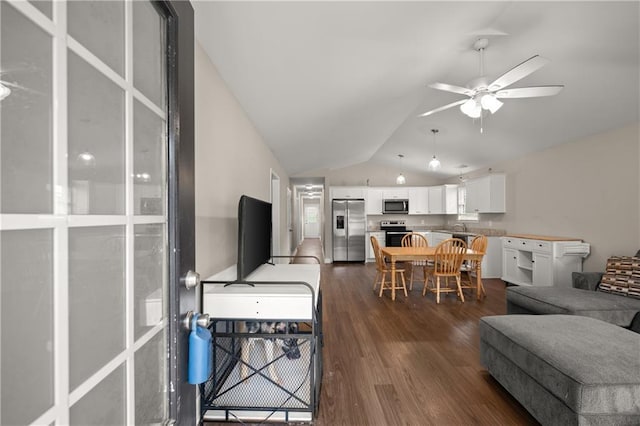1672 Meadow Lark Ln, Gainesville, GA 30501 - living area with vaulted ceiling, a ceiling fan, and dark wood-type flooring