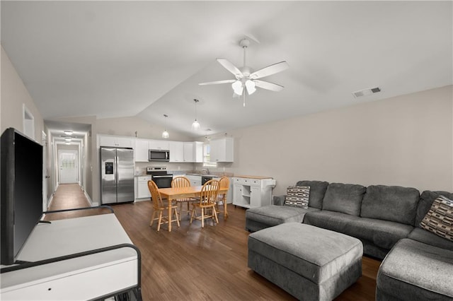 1672 Meadow Lark Ln, Gainesville, GA 30501 - living room featuring vaulted ceiling, a ceiling fan, dark wood-style floors, and plenty of natural light