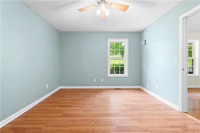 6752 Stringer Rd, Clermont, GA 30527 - empty room featuring light wood-style flooring, a ceiling fan, and baseboards