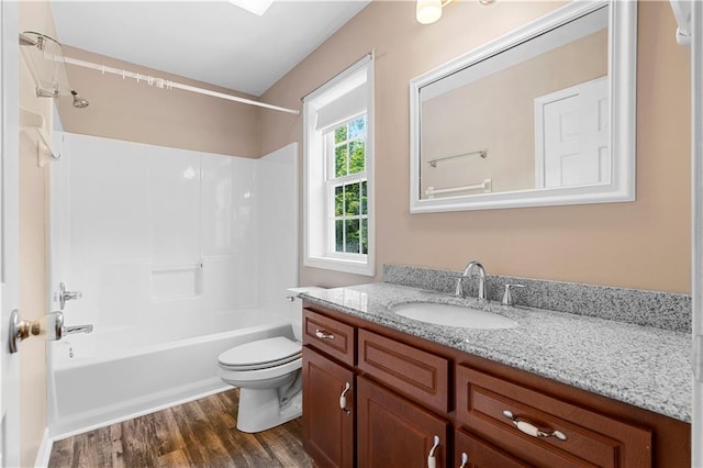6752 Stringer Rd, Clermont, GA 30527 - full bathroom featuring vanity, toilet, washtub / shower combination, and wood finished floors