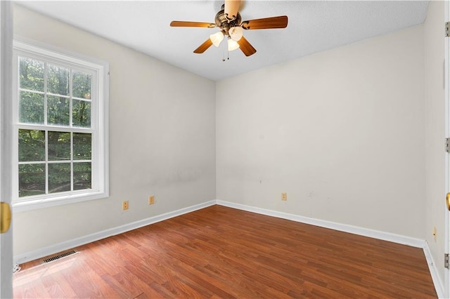 6752 Stringer Rd, Clermont, GA 30527 - empty room with wood finished floors, baseboards, and ceiling fan
