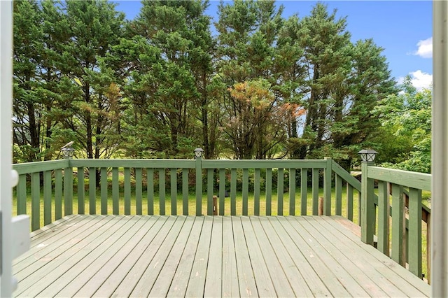 6752 Stringer Rd, Clermont, GA 30527 - wooden terrace featuring a yard and view of wooded area