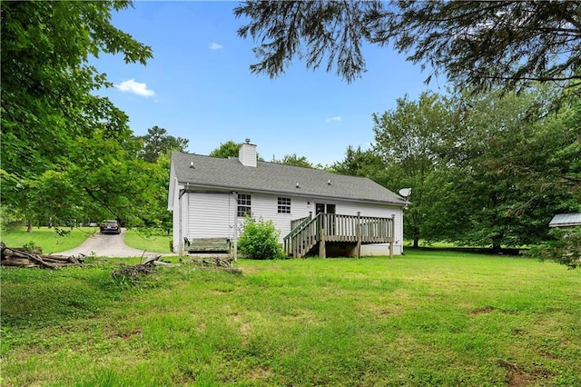 6752 Stringer Rd, Clermont, GA 30527 - back of house with a wooden deck, a yard, and a chimney