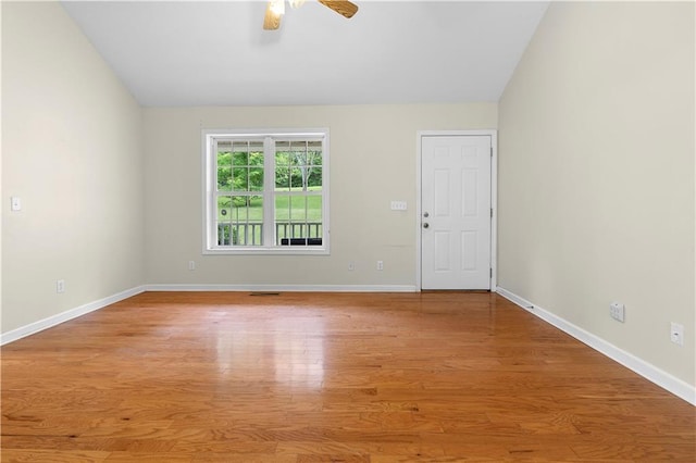 6752 Stringer Rd, Clermont, GA 30527 - spare room with wood finished floors, ceiling fan, baseboards, and lofted ceiling