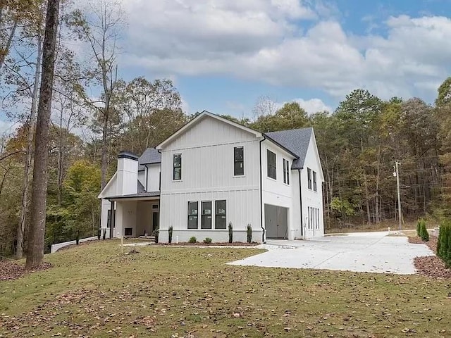 back of property featuring a lawn