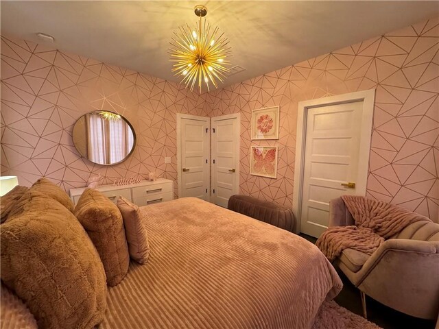 bedroom with a chandelier