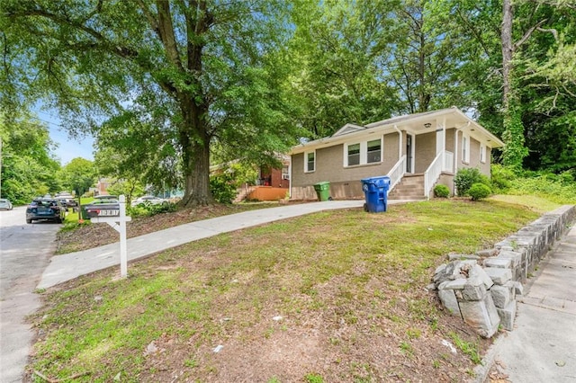 1381 Benteen Way SE, Atlanta, GA 30315 - bungalow-style home featuring concrete driveway and a front lawn