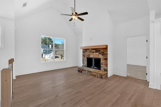 19 Bridgemill Dr, Douglasville, GA 30134 - unfurnished living room featuring high vaulted ceiling, a fireplace, a ceiling fan, and wood finished floors