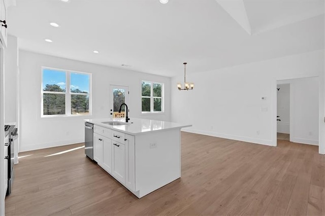 19 Bridgemill Dr, Douglasville, GA 30134 - kitchen with dishwasher, a chandelier, light wood-style floors, white cabinetry, and a center island with sink