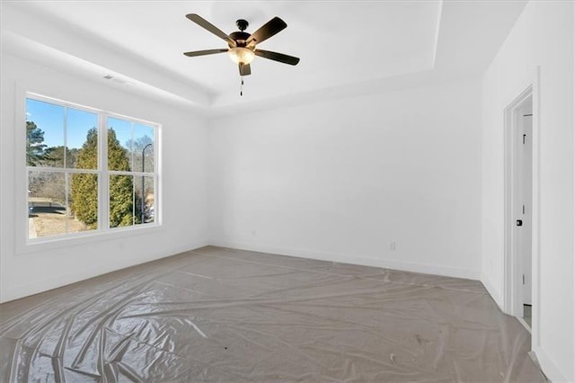 19 Bridgemill Dr, Douglasville, GA 30134 - empty room featuring a tray ceiling and a ceiling fan