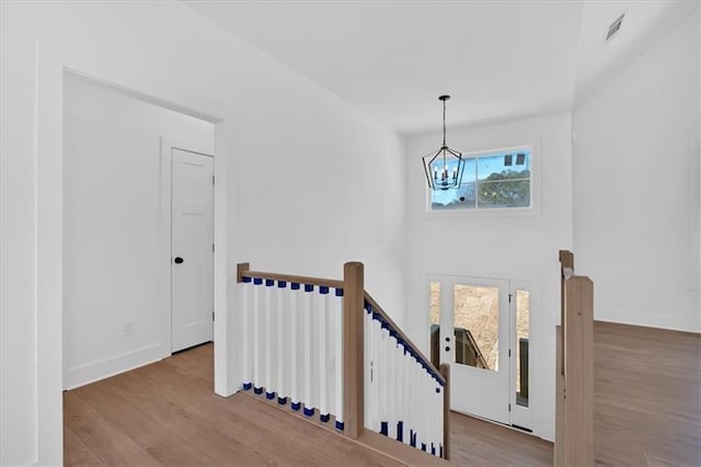 19 Bridgemill Dr, Douglasville, GA 30134 - stairs featuring a chandelier and wood finished floors