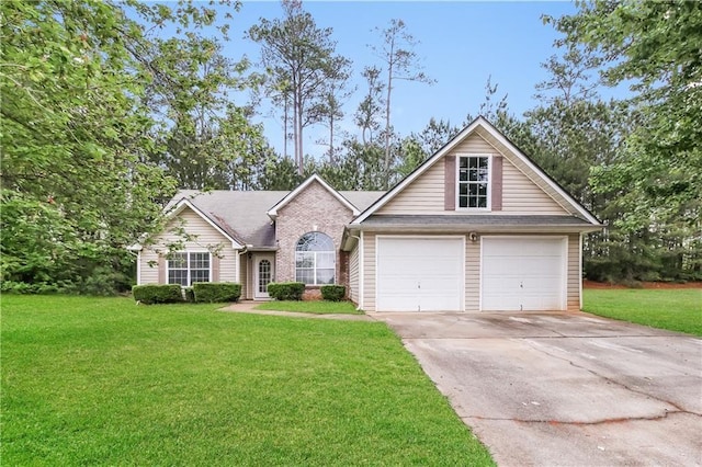 155 Oak Terrace Dr, Covington, GA 30016 - traditional-style house featuring a front lawn, concrete driveway, and an attached garage
