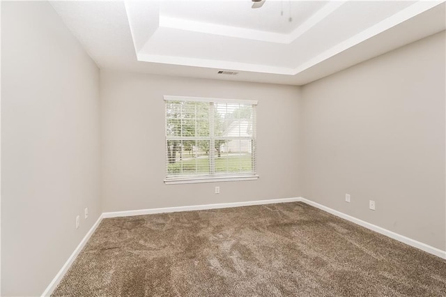 155 Oak Terrace Dr, Covington, GA 30016 - carpeted spare room featuring a tray ceiling and baseboards