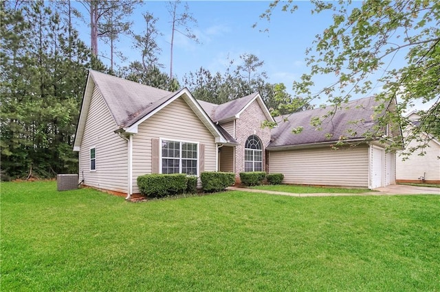 155 Oak Terrace Dr, Covington, GA 30016 - view of front of house with a front lawn, a garage, driveway, and central AC