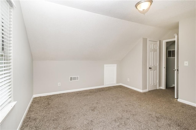 155 Oak Terrace Dr, Covington, GA 30016 - additional living space with lofted ceiling, carpet, and baseboards