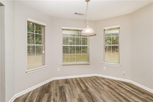 155 Oak Terrace Dr, Covington, GA 30016 - unfurnished dining area with wood finished floors and baseboards