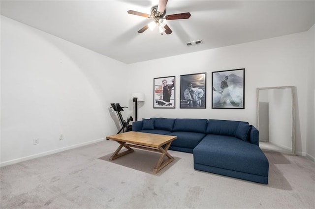 carpeted living room featuring ceiling fan