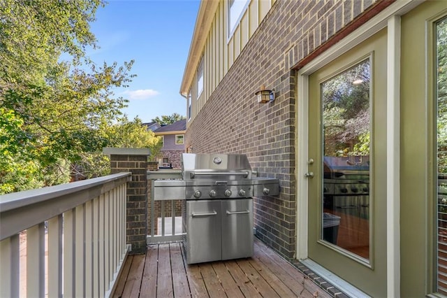 wooden deck featuring area for grilling