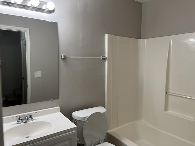 full bathroom with vanity, toilet, and shower / washtub combination