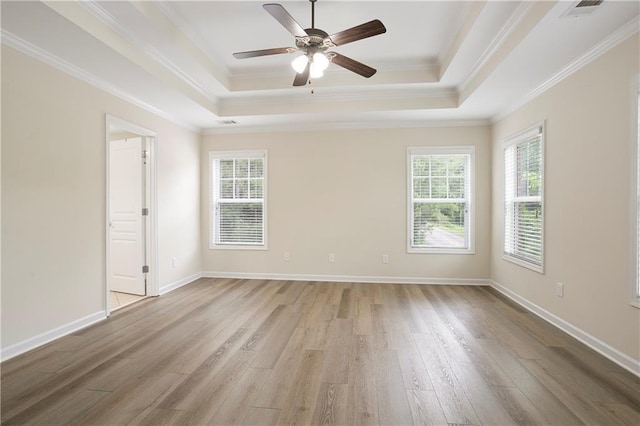 4130 Stonecypher Rd, Suwanee, GA 30024 - unfurnished room featuring a raised ceiling, light wood-style floors, a ceiling fan, and crown molding