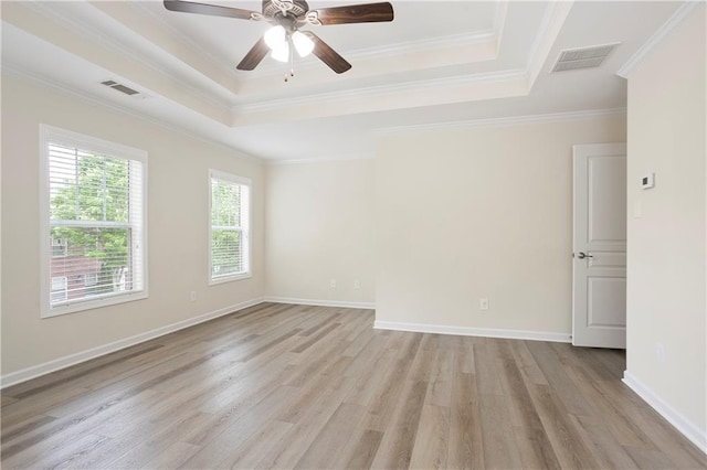 4130 Stonecypher Rd, Suwanee, GA 30024 - spare room with light wood-style flooring, a raised ceiling, ceiling fan, and crown molding