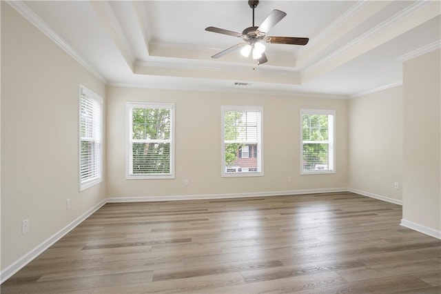 4130 Stonecypher Rd, Suwanee, GA 30024 - unfurnished room featuring wood finished floors, a tray ceiling, a ceiling fan, and crown molding
