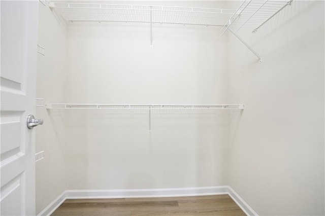 4130 Stonecypher Rd, Suwanee, GA 30024 - spacious closet with wood finished floors