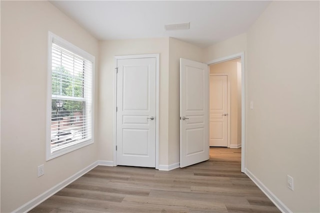 4130 Stonecypher Rd, Suwanee, GA 30024 - unfurnished bedroom with light wood-type flooring and baseboards
