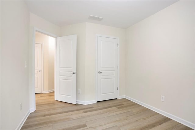 4130 Stonecypher Rd, Suwanee, GA 30024 - unfurnished bedroom with light wood finished floors and baseboards