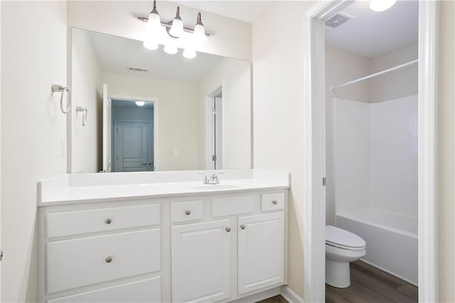 4130 Stonecypher Rd, Suwanee, GA 30024 - bathroom featuring vanity, wood finished floors, and shower / bathtub combination