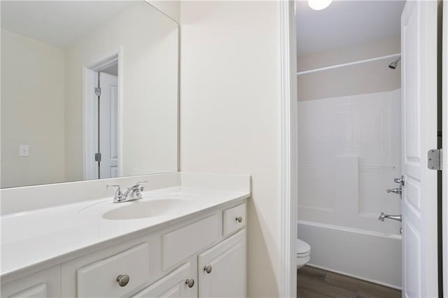 4130 Stonecypher Rd, Suwanee, GA 30024 - full bathroom with vanity, wood finished floors, and  shower combination