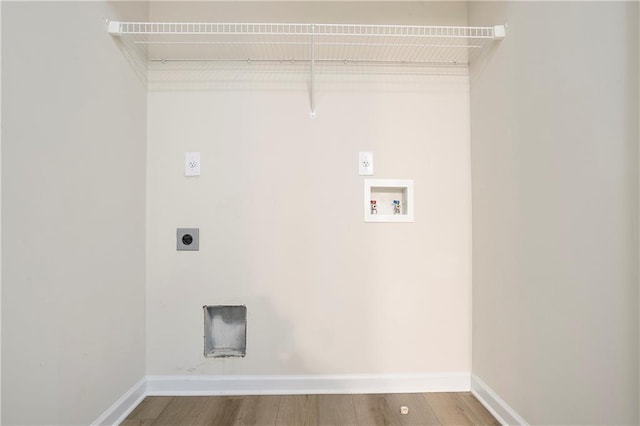 4130 Stonecypher Rd, Suwanee, GA 30024 - laundry room featuring hookup for an electric dryer, hookup for a washing machine, and wood finished floors