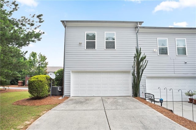 4130 Stonecypher Rd, Suwanee, GA 30024 - view of home's exterior with driveway, an attached garage, and a lawn