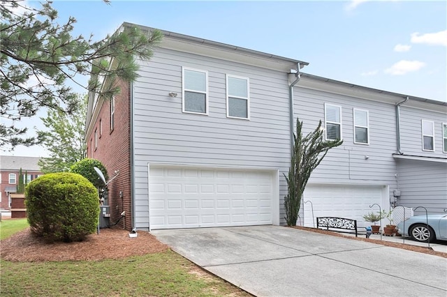 4130 Stonecypher Rd, Suwanee, GA 30024 - view of side of home featuring an attached garage and concrete driveway