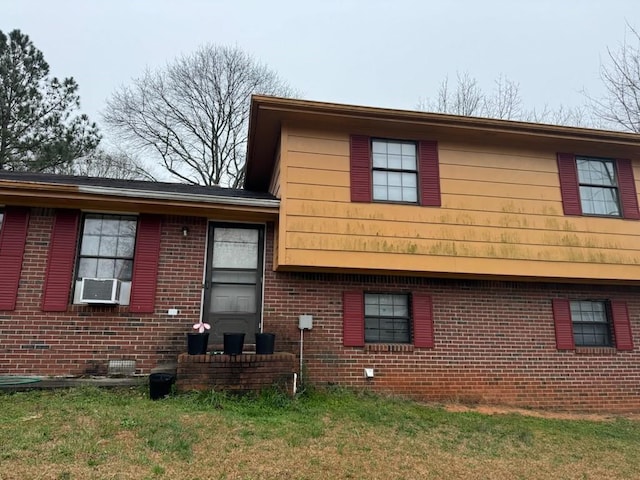 5790 Twain Dr, Ellenwood, GA 30294 - view of side of property with brick siding, cooling unit, and a lawn