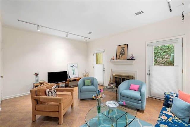 5180 Chemin De Vie, Atlanta, GA 30342 - living room with track lighting and a fireplace with raised hearth
